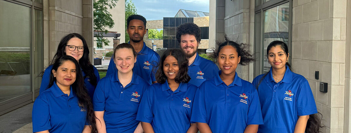 University of Tulsa graduate admissions team wearing blue shirts