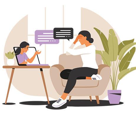 Woman in armchair during online therapy session on laptop