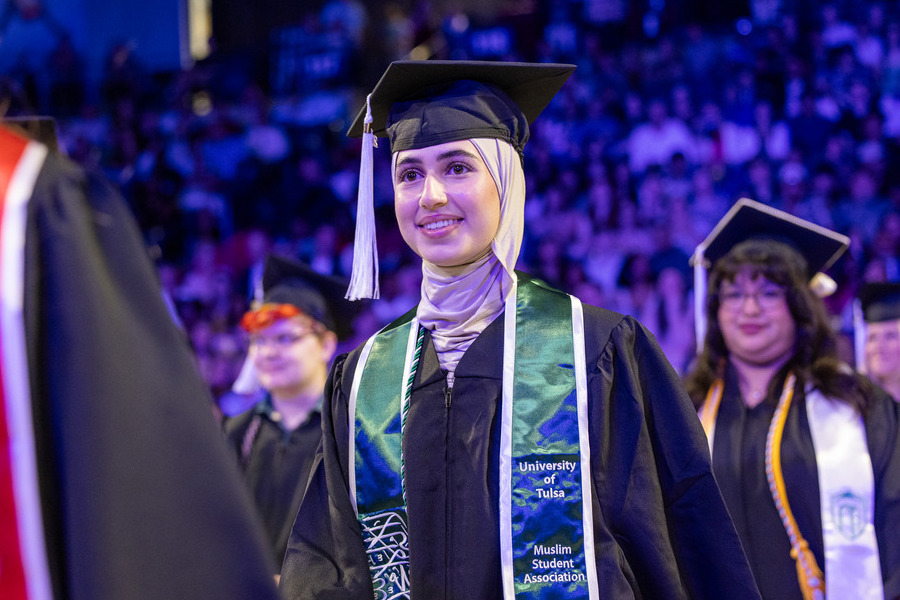 Graduate in cap and gown at University of Tulsa commencement 2026