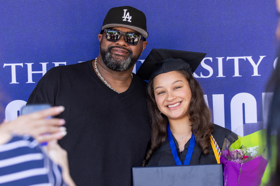 Graduate with father at commencement 2026 ceremony