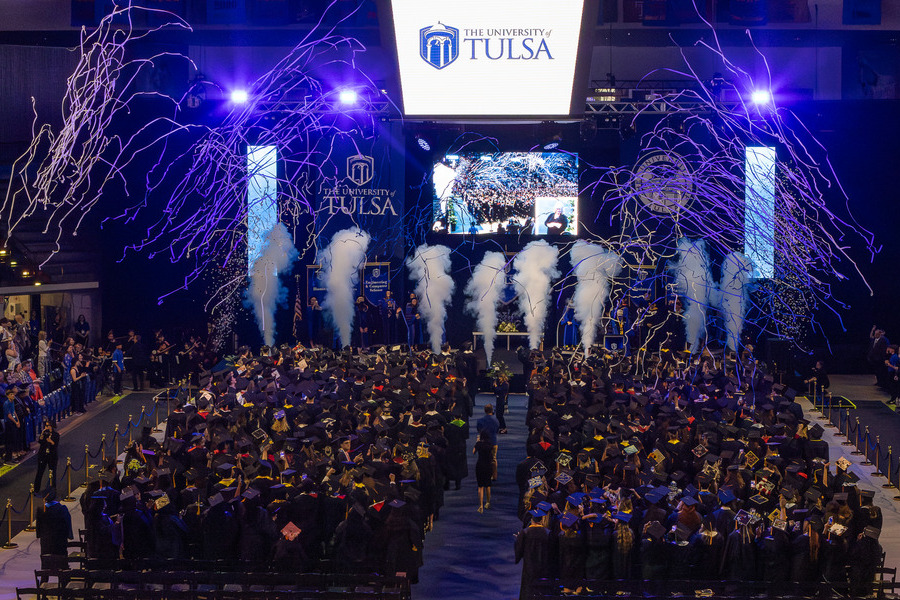 The University of Tulsa 2026 graduate commencement ceremony with confetti and smoke effects.