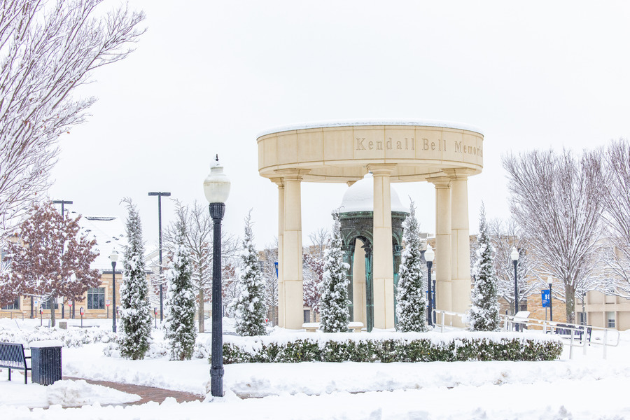 Snow-covered Kendall Bell with surrounding snow-laden trees
