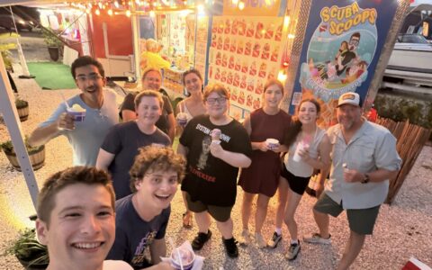 Group of students with ice cream at ice cream truck