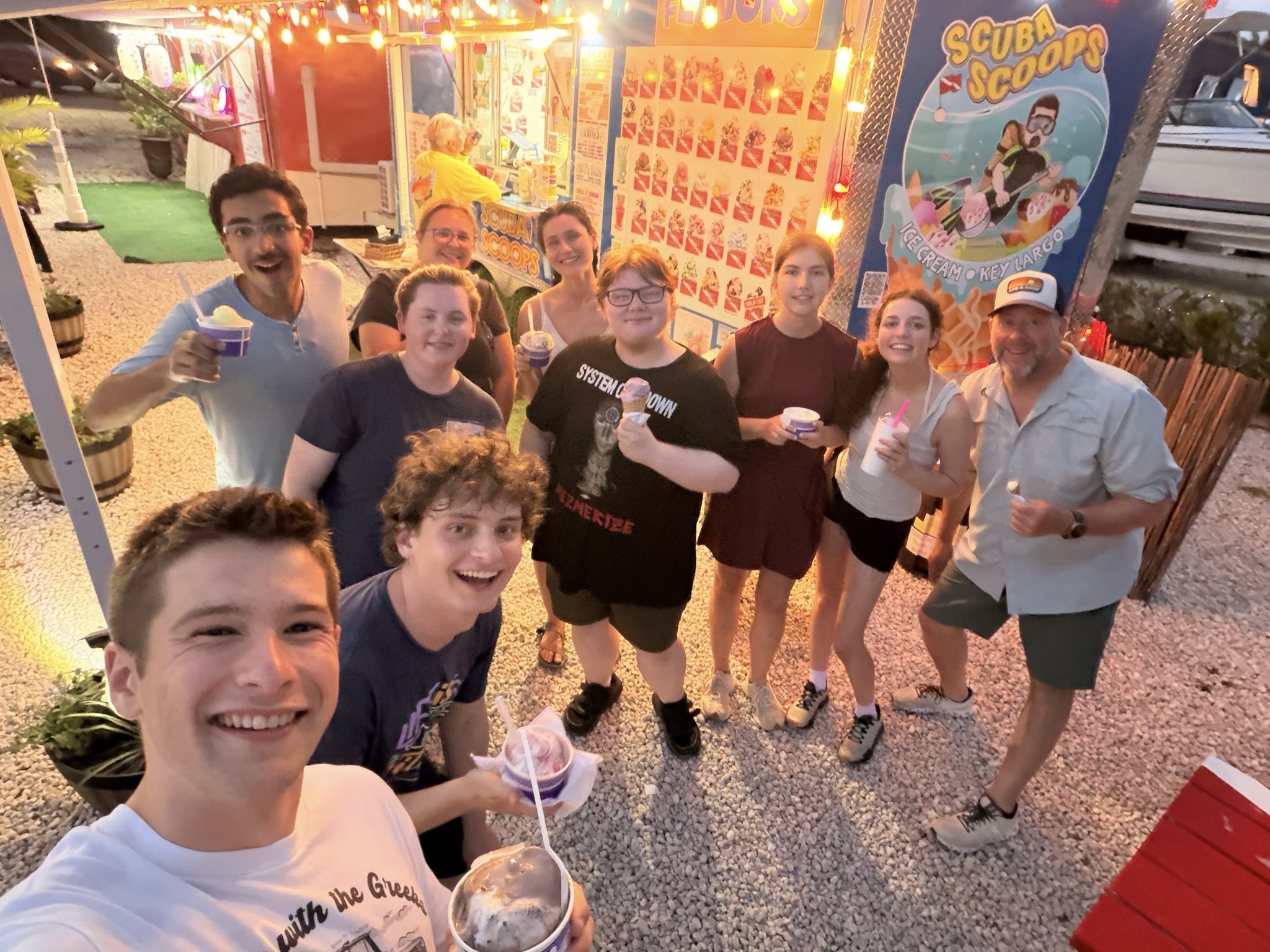 Group of students with ice cream at ice cream truck