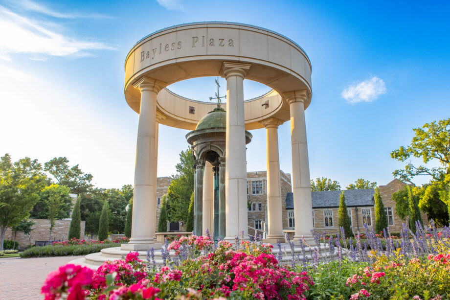 Bayless Plaza with pink flowers and blue sky