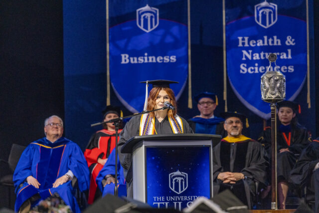 Kadee Jo Ransom addresses graduates at commencement.