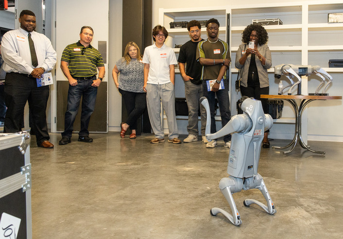 People watch robot demonstration at innovation institute