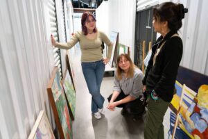 Students examine local artist's work
