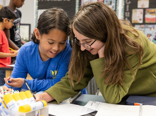 Two students working together on a project.