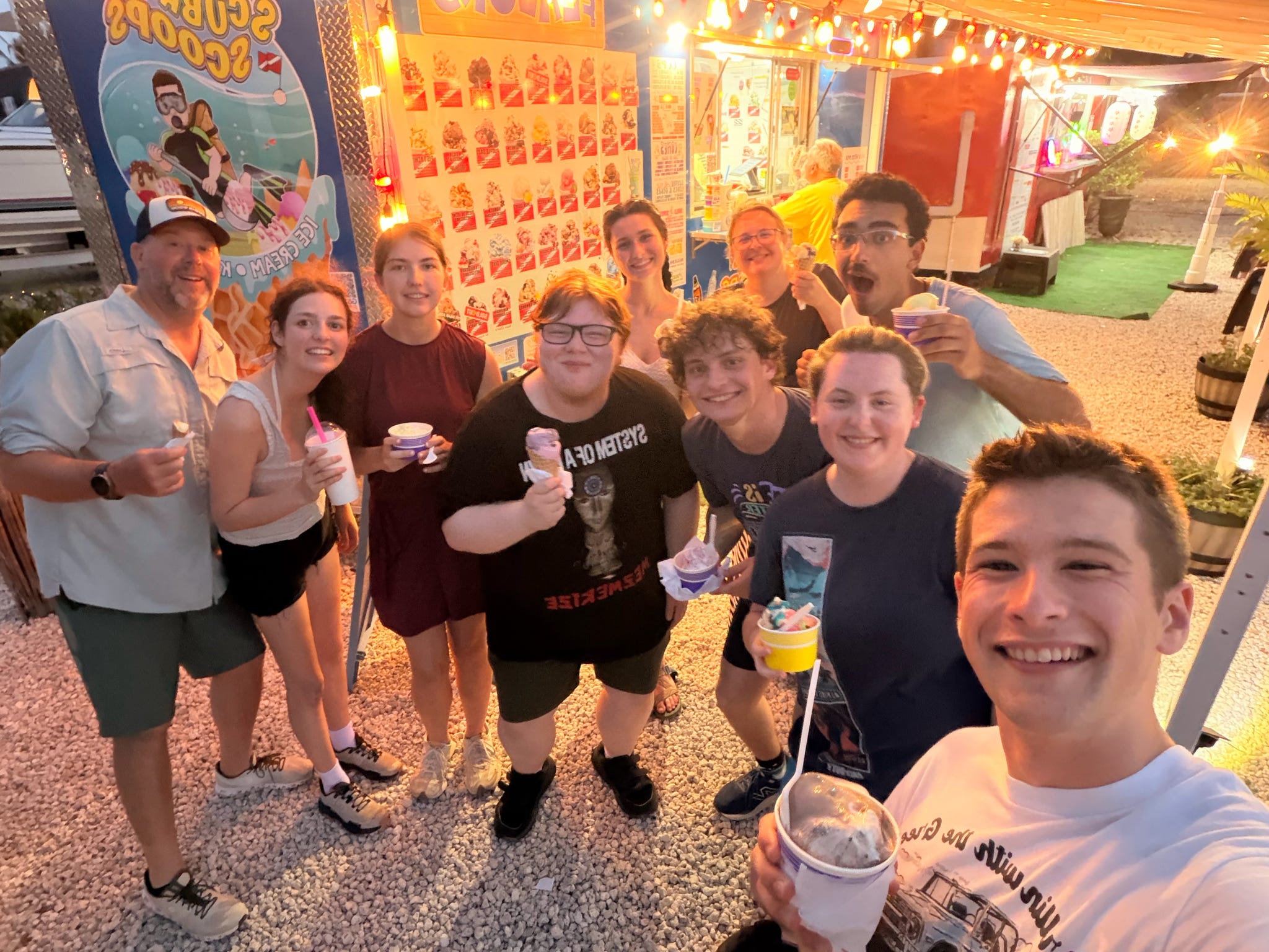Group enjoying ice cream by a food truck