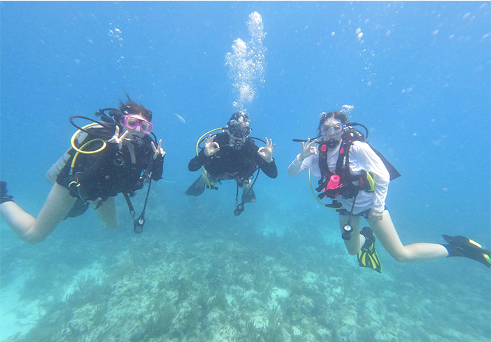Three scuba divers underwater