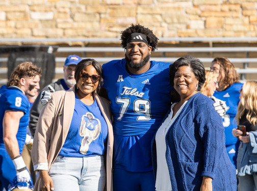 Tulsa football player with family