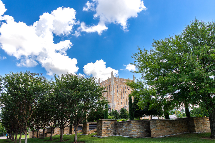 Campus building with trees and blue sky