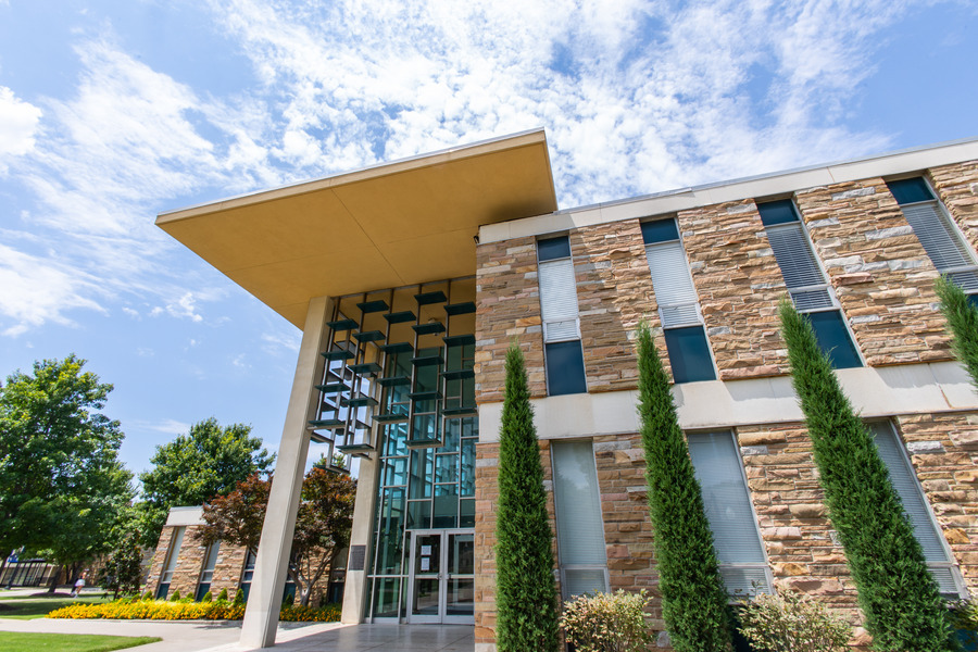 Modern campus building with stone facade