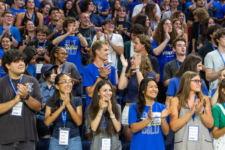 Students in blue shirts at orientation