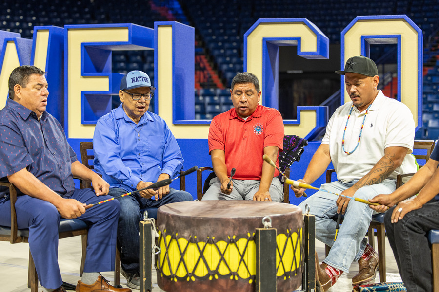 Native American men drumming at orientation