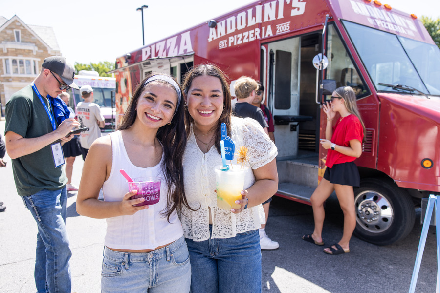 Students and parents at a food truck event