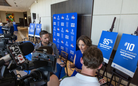 UTulsa President Stacy Leeds with reporters and photographers