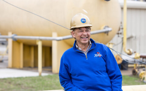 Mohan Kelkar in a blue sweatshirt and hard hat.