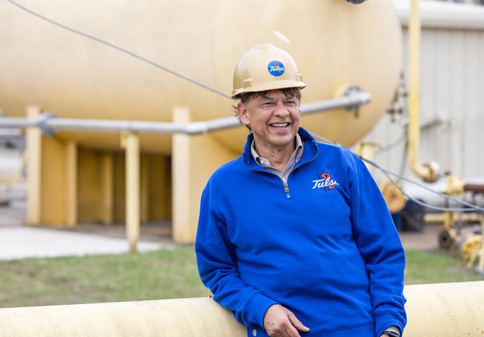 Mohan Kelkar in a blue sweatshirt and hard hat.