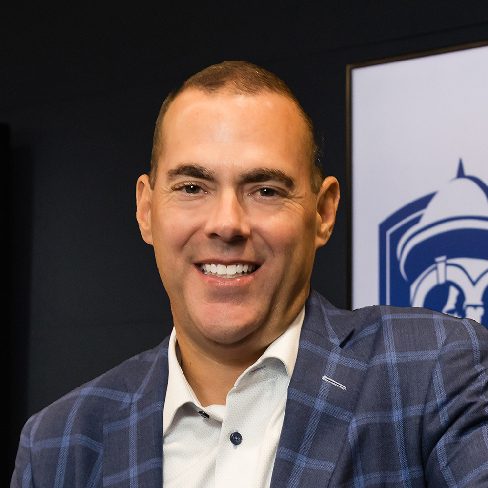 Man in suit smiling