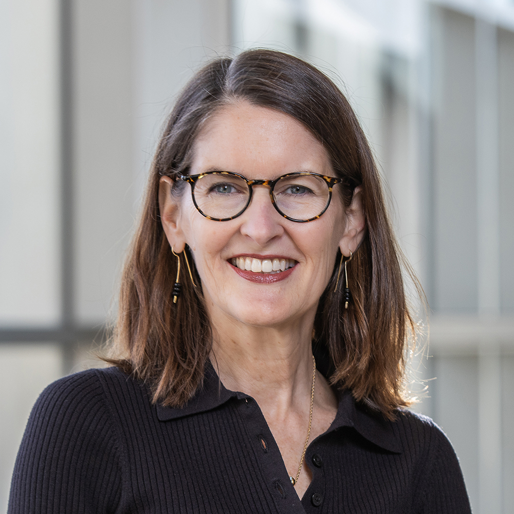 Woman with glasses smiling