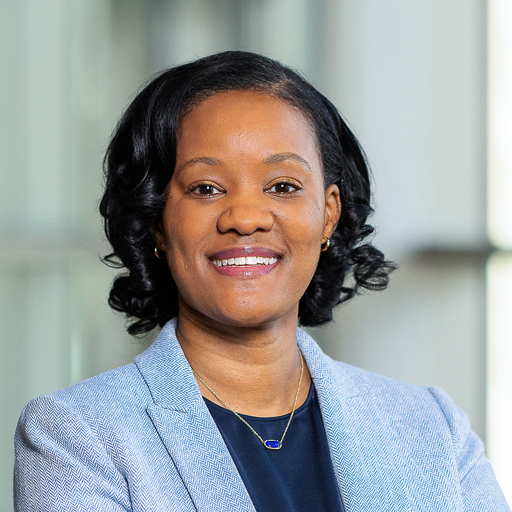 Woman in blue blazer smiling
