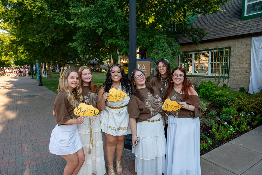The new members of Kappa Delta pose in front of their house