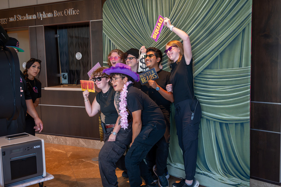 Students pose for photo booth at Festival de las Flores