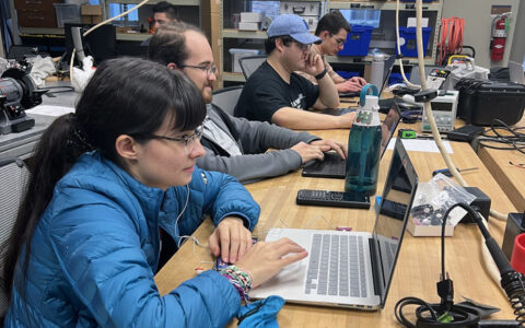 ECE students working on laptops